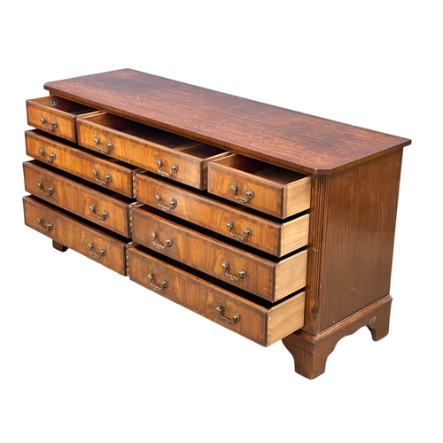 917 - A large Georgian style mahogany multi draw chest. 152x46x76cm