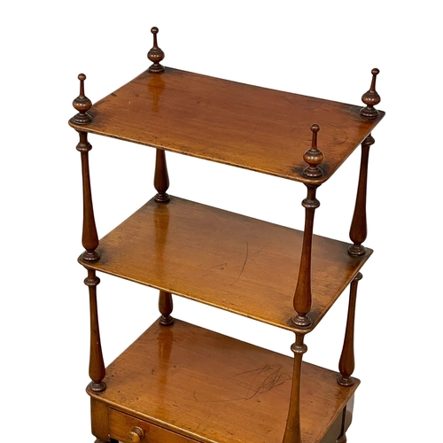 922 - A Victorian mahogany 3 tier whatnot with drawer on brass cup casters. 1860-1870 52x35x104cm