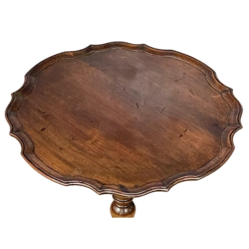 925 - A good quality vintage mahogany pedestal occasional table on lion paw feet. 48x61cm