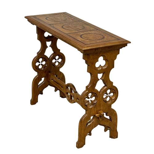 927 - A Victorian oak side table in the Neo Gothic style. Circa 1880. 91.5x38.5x76.5cm.