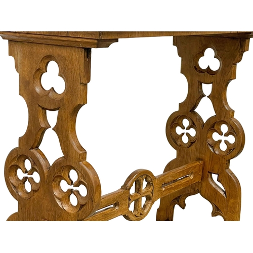 927 - A Victorian oak side table in the Neo Gothic style. Circa 1880. 91.5x38.5x76.5cm.