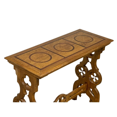 927 - A Victorian oak side table in the Neo Gothic style. Circa 1880. 91.5x38.5x76.5cm.