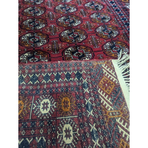 934 - A good quality vintage Middle Eastern hand knotted rug. 123x203cm