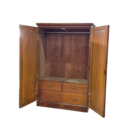 937 - A Victorian Satin Birch wardrobe. 132x61x199cm