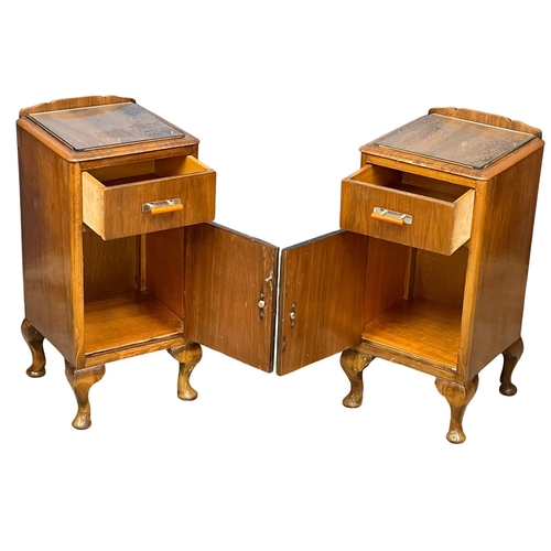 939 - A pair of vintage Walnut bedside cabinets with glass insert tops. 33x34x64cm.