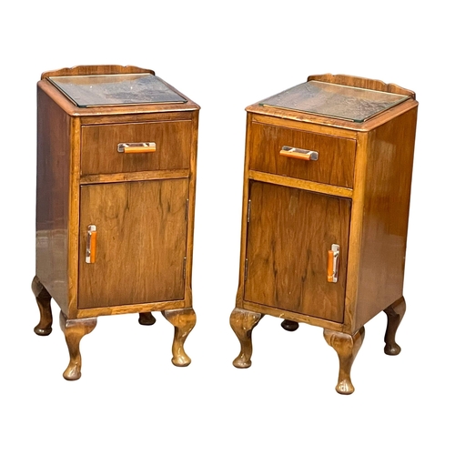 939 - A pair of vintage Walnut bedside cabinets with glass insert tops. 33x34x64cm.