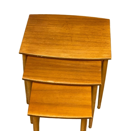 948 - A Mid Century teak and beech nest of tables.