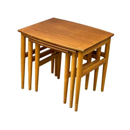 948 - A Mid Century teak and beech nest of tables.