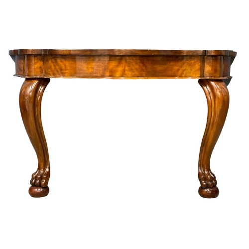 953 - A Victorian mahogany console table on lion paw feet. 123x54x70cm