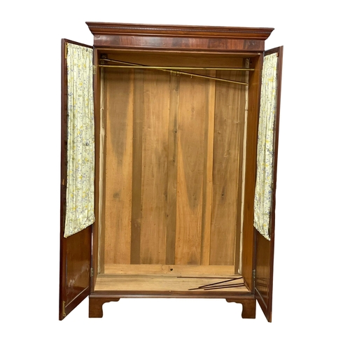 954 - A late Victorian mahogany double door wardrobe with astragal glazed doors. 133x59x214cm