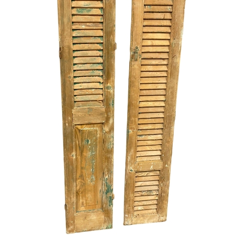 967 - A pair of large 19th century French pine shutters. 216cm