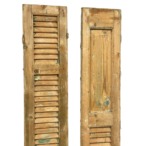 967 - A pair of large 19th century French pine shutters. 216cm