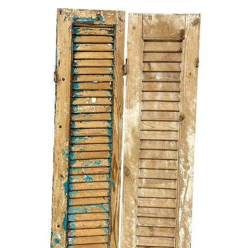 968 - A pair of large 19th century French pine shutters. 207.5cm