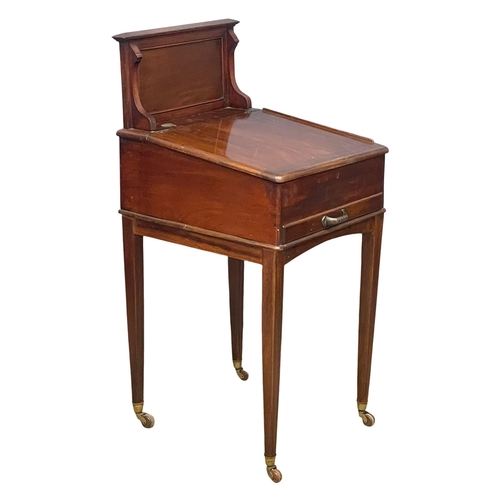 983 - A late Victorian mahogany clerks desk. 59x53x118cm