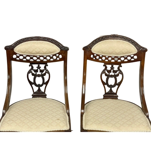 990 - A pair of Edwardian mahogany parlour nursing chairs.