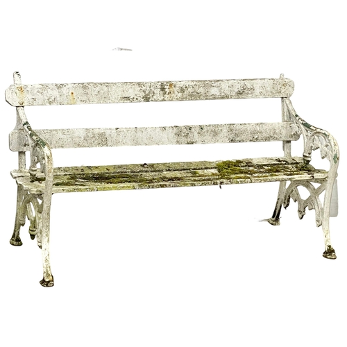 997 - A Victorian cast iron garden bench with wooden straps. 153cm