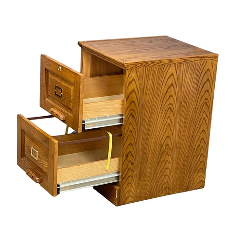 998 - An oak 2 drawer filing chest. 48x58x77cm