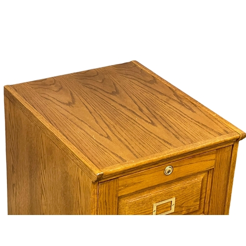 998 - An oak 2 drawer filing chest. 48x58x77cm