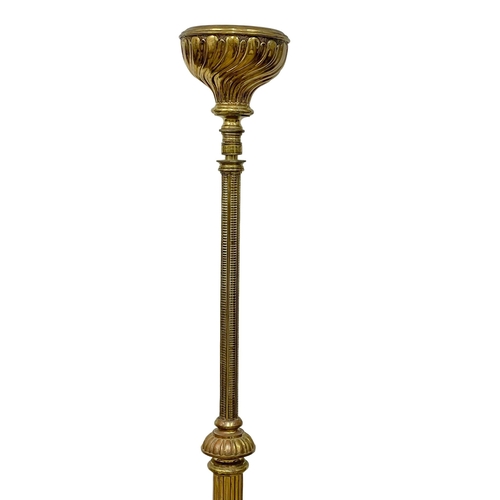 849 - A large Victorian brass candle stand on lion paw feet