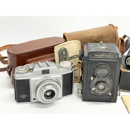 748 - 3 vintage cameras.