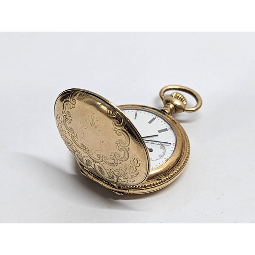 591 - An ornate vintage rolled gold ladies pocket watch, by Elgin.