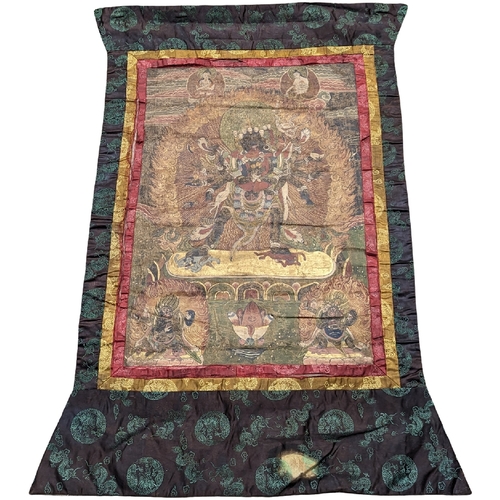 768 - A vintage silk Buddhist Thangka. 86x118cm