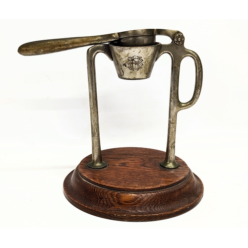 769 - An Edwardian juicer. 23cm