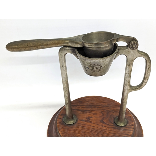 769 - An Edwardian juicer. 23cm