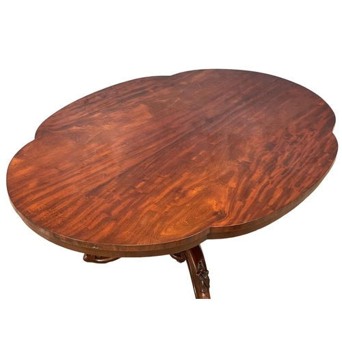 1077 - A Victorian mahogany tilt top pedestal breakfast table. 147.5x109x72.5cm.