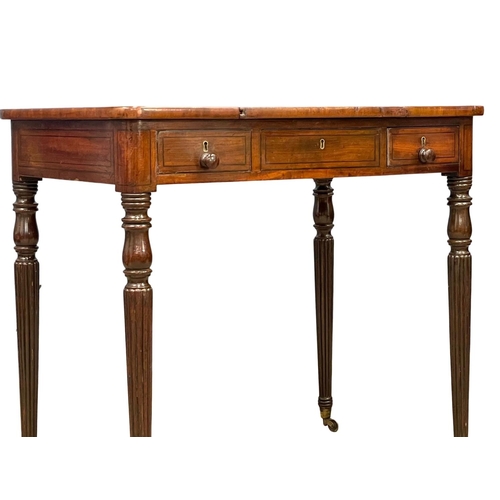 1088 - A George IV mahogany games side table with drawer, on brass cup casters. In the manner of Gillows. C... 