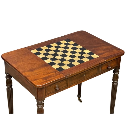 1088 - A George IV mahogany games side table with drawer, on brass cup casters. In the manner of Gillows. C... 