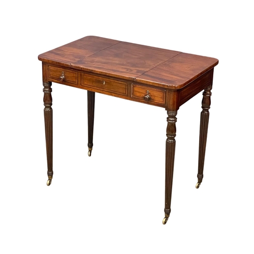 1088 - A George IV mahogany games side table with drawer, on brass cup casters. In the manner of Gillows. C... 