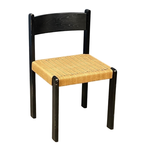 1095 - A Danish ebony chair with paper cord seat.