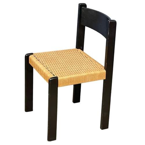 1095 - A Danish ebony chair with paper cord seat.