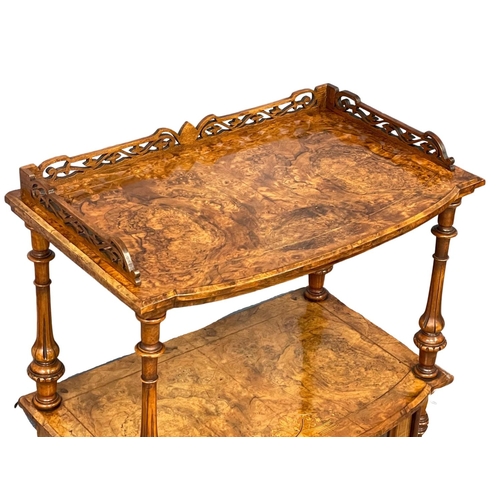 1097 - A good quality Victorian Burr Walnut Canterbury. 66x38x105cm