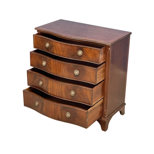 1098 - A fine proportioned Georgian style inlaid mahogany serpentine front chest of drawers. 80x45x85cm