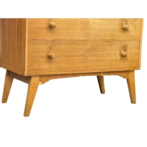 1002 - A G-Plan Mid Century oak dressing chest.  92x46x147cm