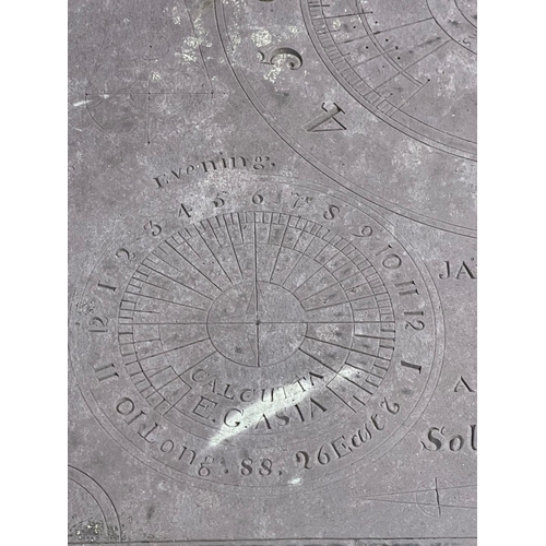 1029 - A 19th century cast iron based sundial with slate top.  Inscribed James McMeekan, 1842.  51x40x71cm