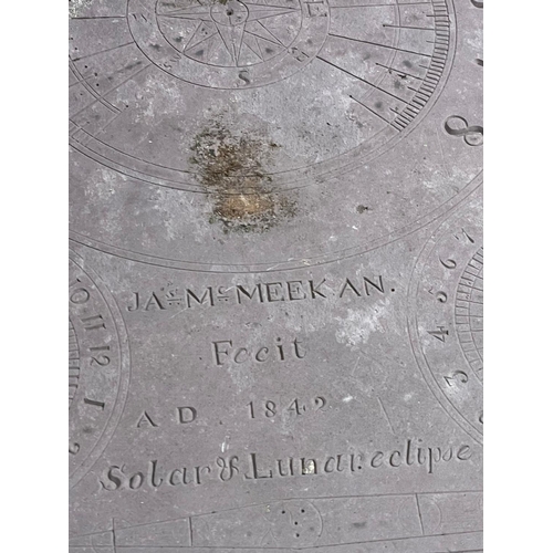 1029 - A 19th century cast iron based sundial with slate top.  Inscribed James McMeekan, 1842.  51x40x71cm