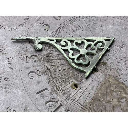 1029 - A 19th century cast iron based sundial with slate top.  Inscribed James McMeekan, 1842.  51x40x71cm