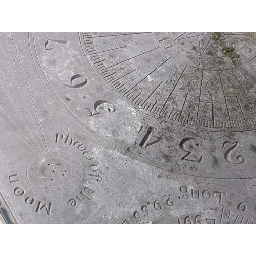 1029 - A 19th century cast iron based sundial with slate top.  Inscribed James McMeekan, 1842.  51x40x71cm