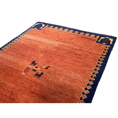 1059 - A good quality wool rug.  124x187cm