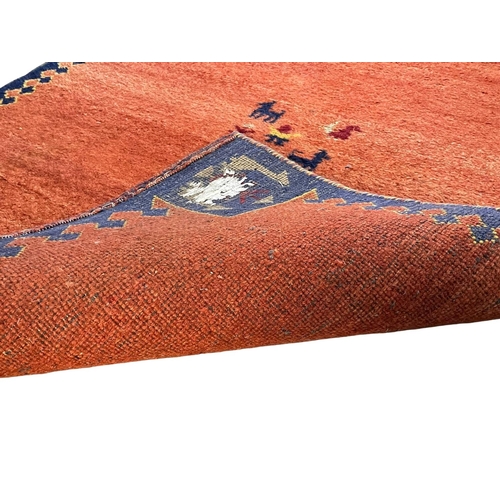 1059 - A good quality wool rug.  124x187cm