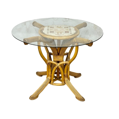 1060 - A good quality rattan conservatory glass top table and 4 chairs.  Table, 99x74cm