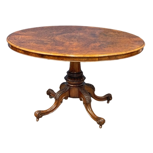 1063 - A Victorian burr walnut tilt top breakfast table.  128x98x75cm