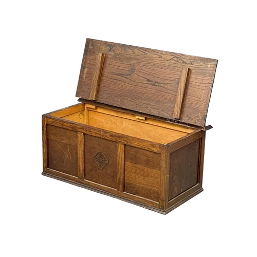 1065 - A vintage oak storage box.  91x45x40cm