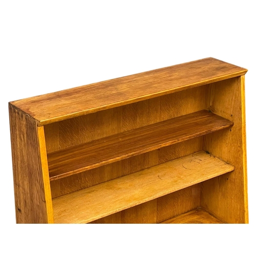 1067 - A Herbert Gibbs Mid Century oak open bookcase.  89x28x113.5cm