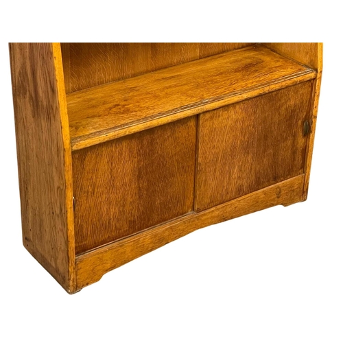 1067 - A Herbert Gibbs Mid Century oak open bookcase.  89x28x113.5cm