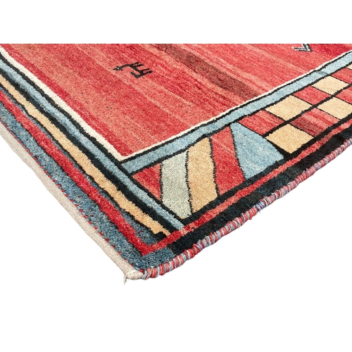 1070 - A large vintage North African hand knotted rug.  291x209cm