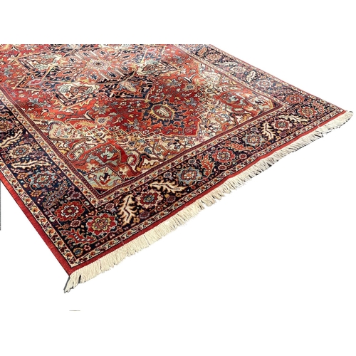 1071 - A large vintage Middle Eastern style Heriz Kadjar rug.  299x201cm